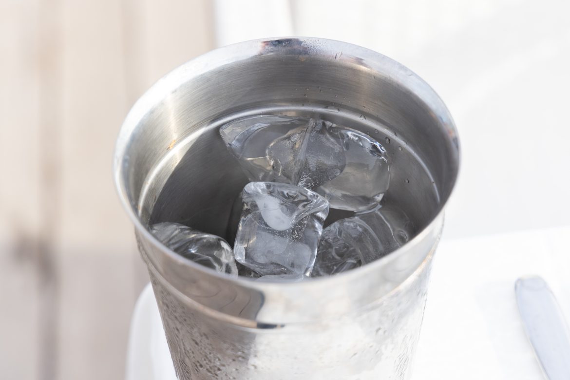 Bucket with ice cubes in it. Photo by engin akyurt on Unsplash.